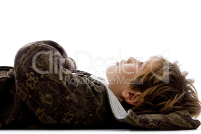 side view of little kid resting on floor