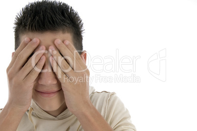 portrait of boy hiding his face