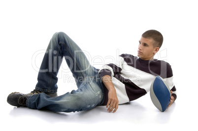 laying boy holding rugby ball