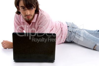 laying man with laptop