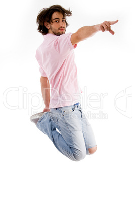 fashionable guy jumping high in the mid air