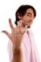 cool guy posing with crossed fingers