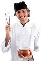 happy chef holding bowl and chopsticks