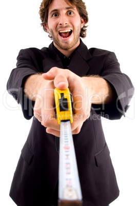 pleased man showing measuring tape