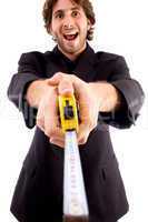 pleased man showing measuring tape