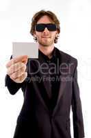 young male holding business card