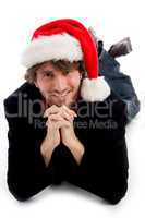 smiling laying male wearing christmas hat
