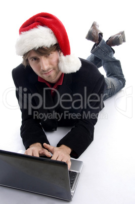 laying man working on laptop