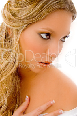 close view of blonde model applying sparkle