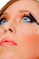 close view of woman applying makeup