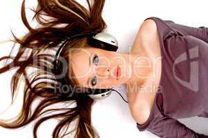 top view of laying female listening music