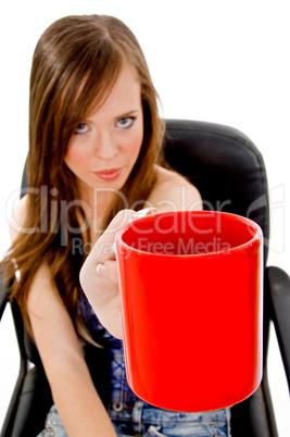 front view of young woman offering drink