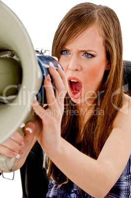 front view of female shouting in loudspeaker