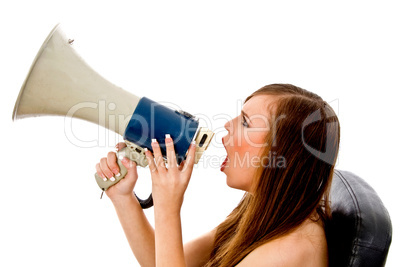 portrair of woman shouting in loudspeaker