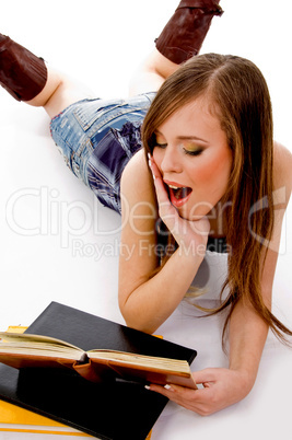 top view of young student reading book