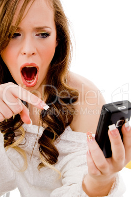 portrait of shocked model pointing at mobile