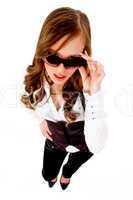 top view of female holding sunglasses