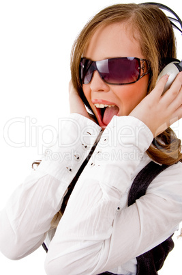 sidepose of shouting woman enjoying music