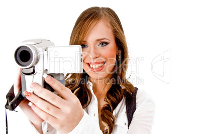 woman carrying videocamera to camera