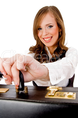 front view of smiling woman holding bag