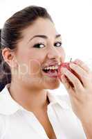 close up of young american model eating an apple