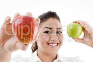 young attractive model showing green and red apple