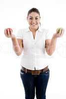 young attractive model holding apples in both hands