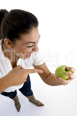 young model indicating the apple