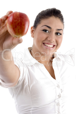 smiling young female showing apple