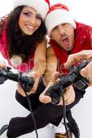 young loving couple on floor playing video game