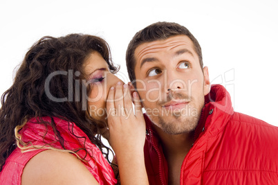 loving caucasian pair whispering a secret