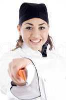 professional female chef holding kitchen tool