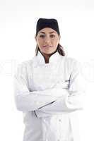 portrait of young beautiful chef posing with crossed arms