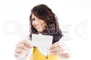 successful female holding business card and showing in front of camera