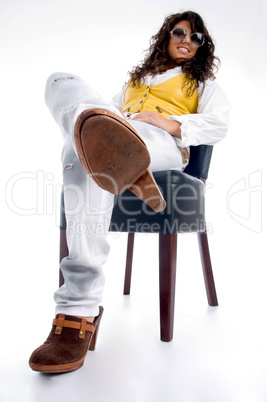 smiling woman sitting on chair