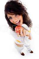 beautiful young woman holding red apple