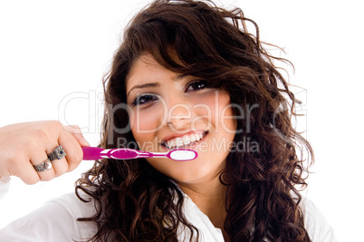 young pretty female holding toothbrush