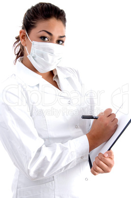 doctor posing with mask on her mouth and writing board