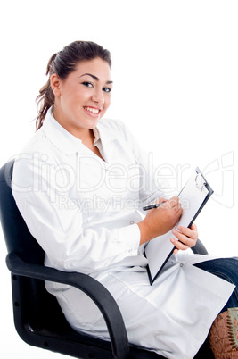 young smiling doctor sitting on chair