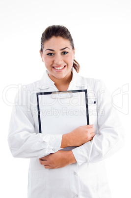 smiling doctor holding writing pad