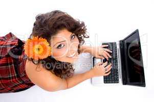 laying woman with laptop