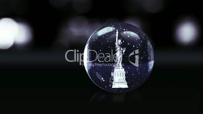 Statue of Liberty in dark blue glass ball with snow