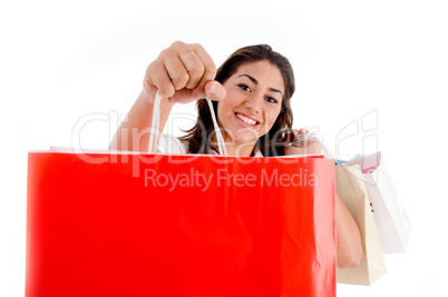 portrait of woman showing shopping bags