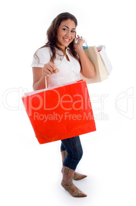 standing woman holding shopping bags