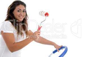 young girl holding rolling brush