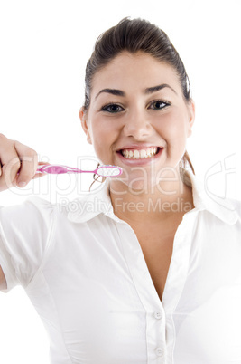 young woman holding toothbrush