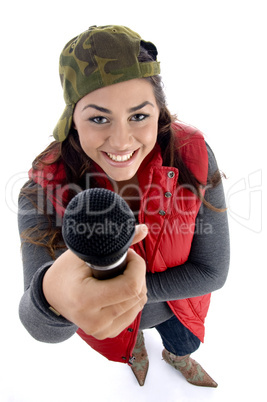 young caucasian offering her microphone