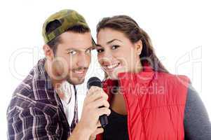 young male and female singer with microphone