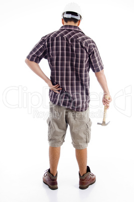 back pose of worker holding hammer