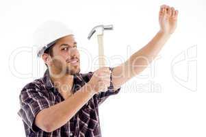 engineer in action with hammer